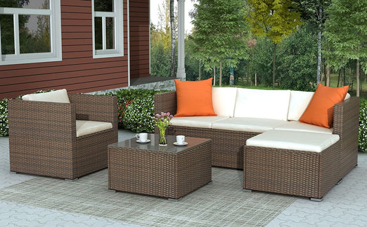 4 Piece Patio Rattan Sectional Set with Cushioned Sofa and Glass-Top Coffee Table